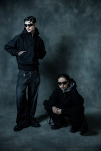 Couple in premium black zip hoodies styling modern urban streetwear for casual everyday wear