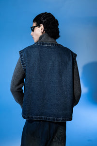 Back view of premium sleeveless denim jacket for men highlighting clean stitching and tailored shape