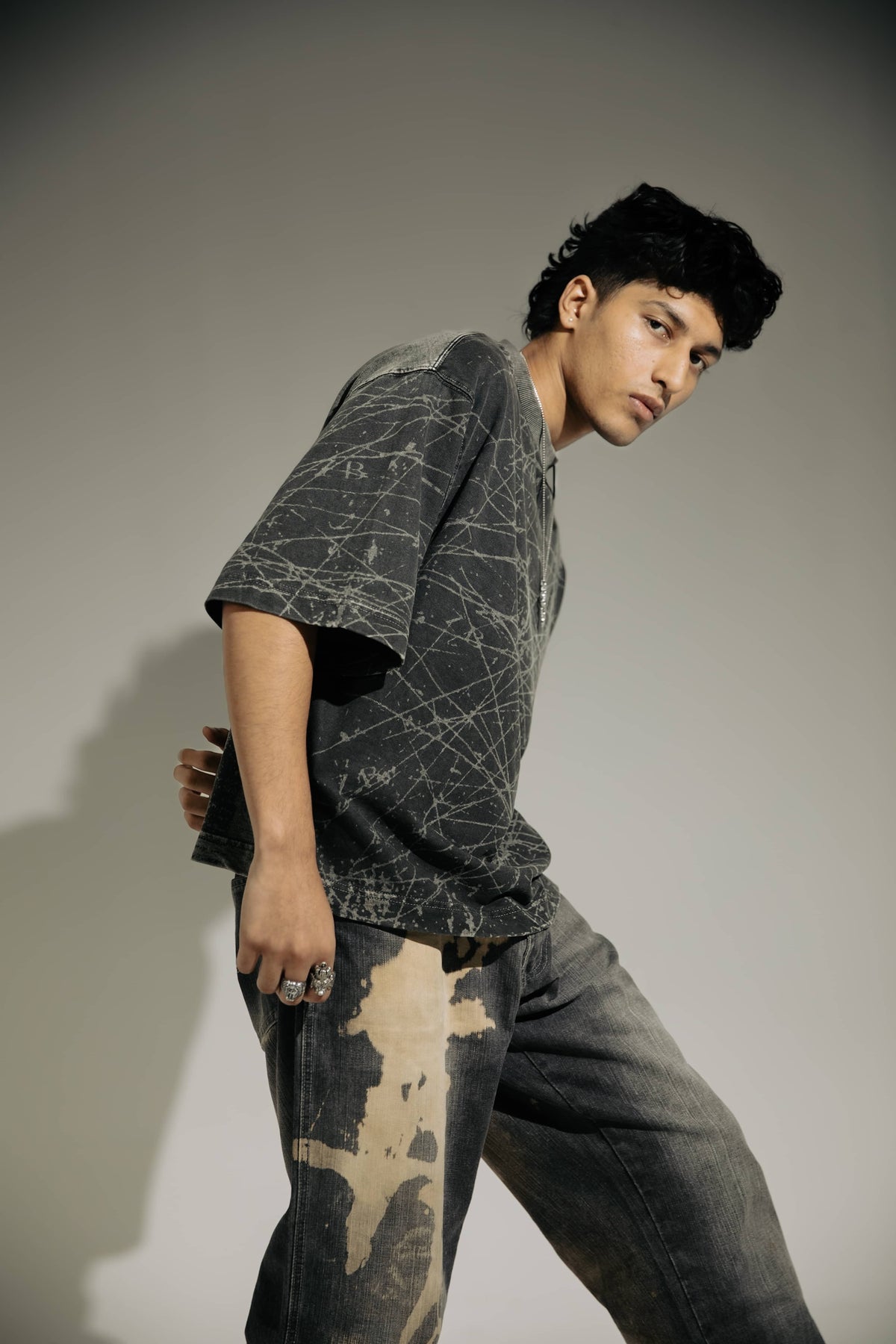 Urban fashion oversized black t-shirt with acid-wash effect, ideal for streetwear