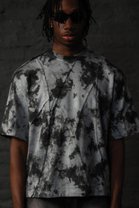 Close up detail of SCAR_ASH oversized acid wash streetwear t-shirt with textured seam construction