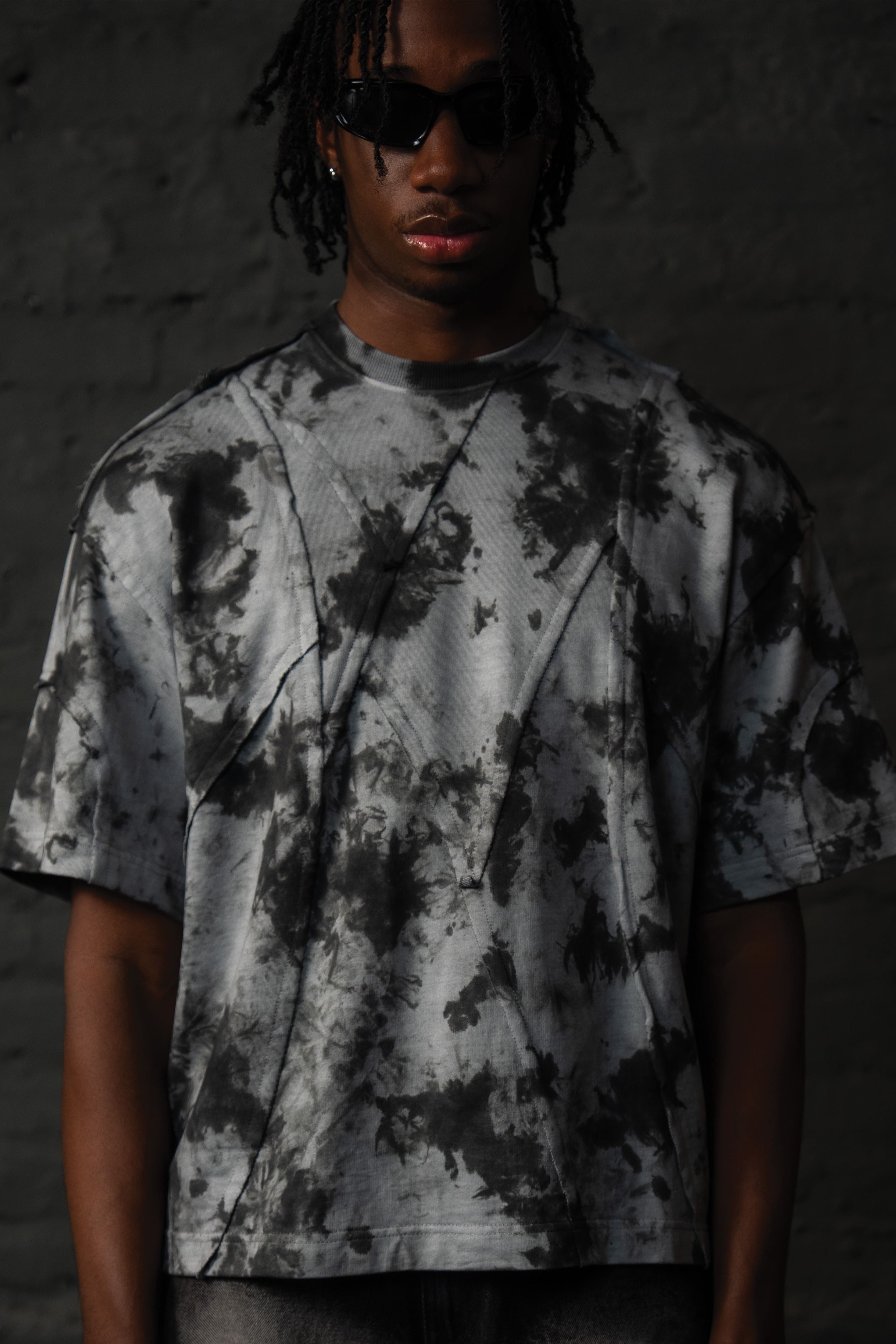 Close up detail of SCAR_ASH oversized acid wash streetwear t-shirt with textured seam construction