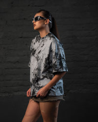Side profile of SCAR_ASH oversized acid wash streetwear t-shirt in grey black abstract wash