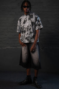 SCAR_ASH oversized acid wash streetwear t-shirt with a relaxed urban fit on male model