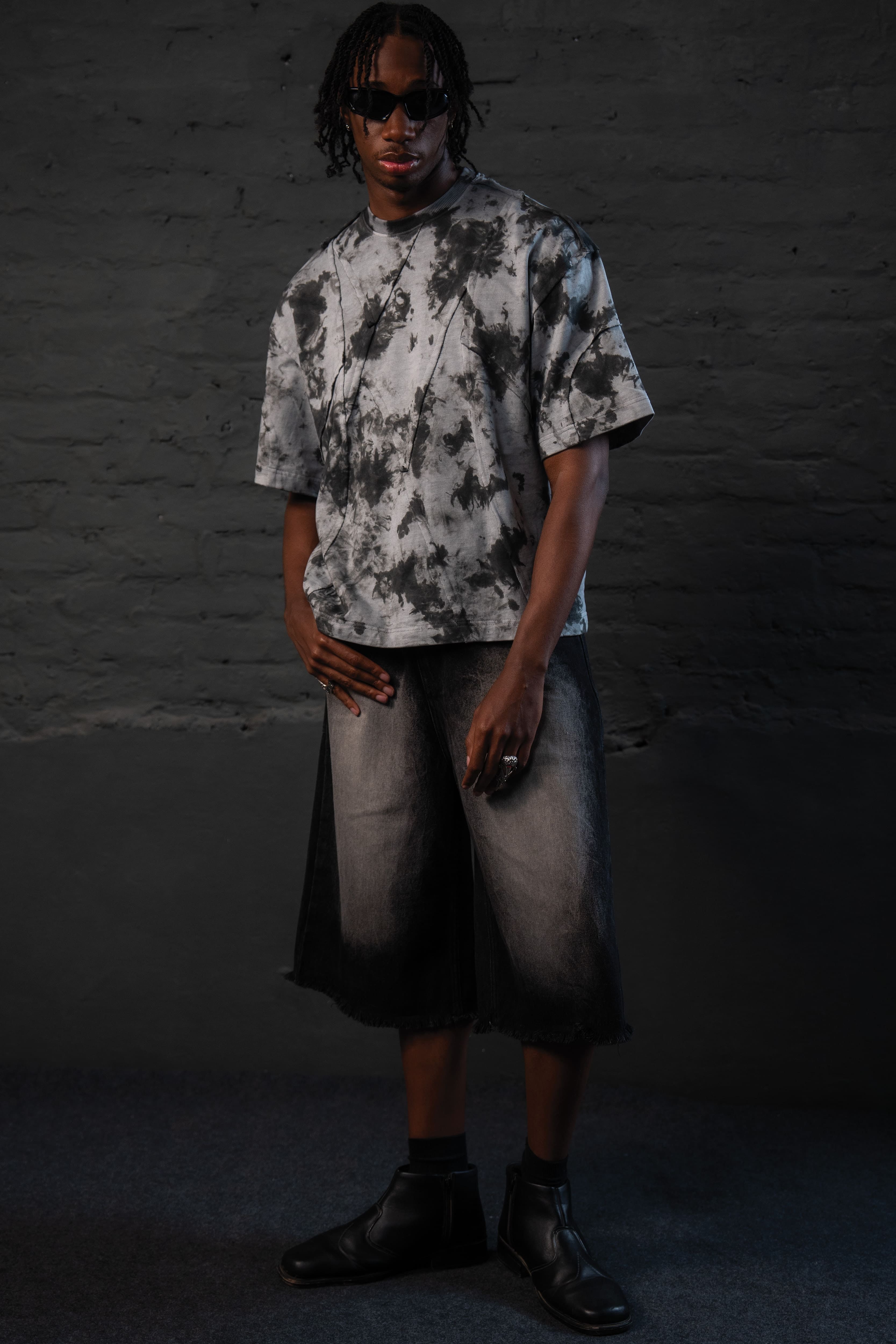 SCAR_ASH oversized acid wash streetwear t-shirt with a relaxed urban fit on male model