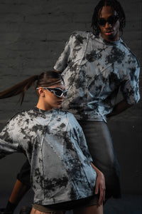 Models styling SCAR_ASH oversized acid wash t-shirt in a luxury urban fashion editorial