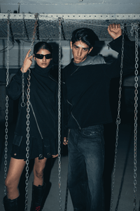 Stylish black oversized shirt, offering a relaxed fit and perfect for casual day wear, made with breathable and sustainable fabric