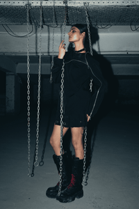 Stylish black oversized shirt in eco-conscious banana crepe fabric, featuring a relaxed fit and modern double zip for an edgy look