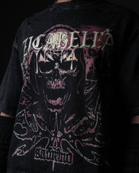 Close-up macro view of the premium skull graphic artwork on a washed black oversized t-shirt