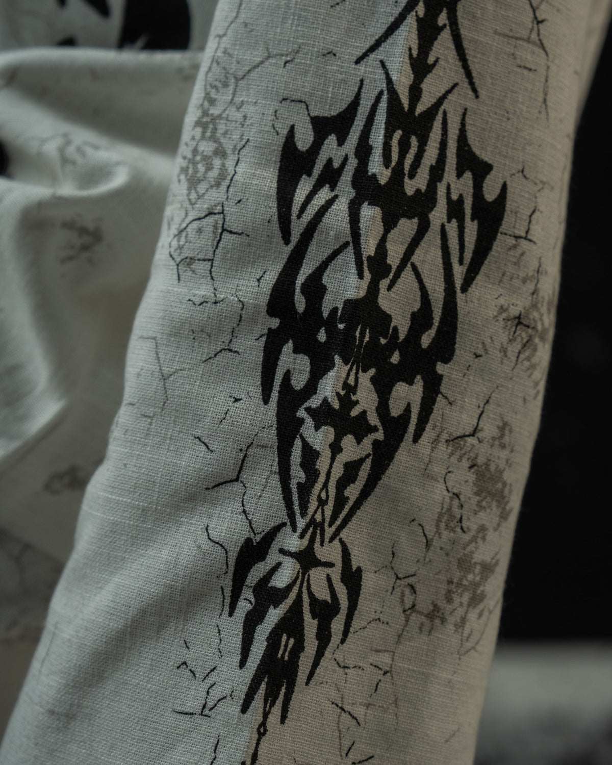 Tribal gothic sleeve graphic on a relaxed unisex full sleeve t-shirt