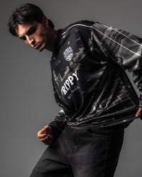 Side profile portrait showcasing custom cyber tunnel graphics on the sleeve of the TRPPY_22 long sleeve jersey