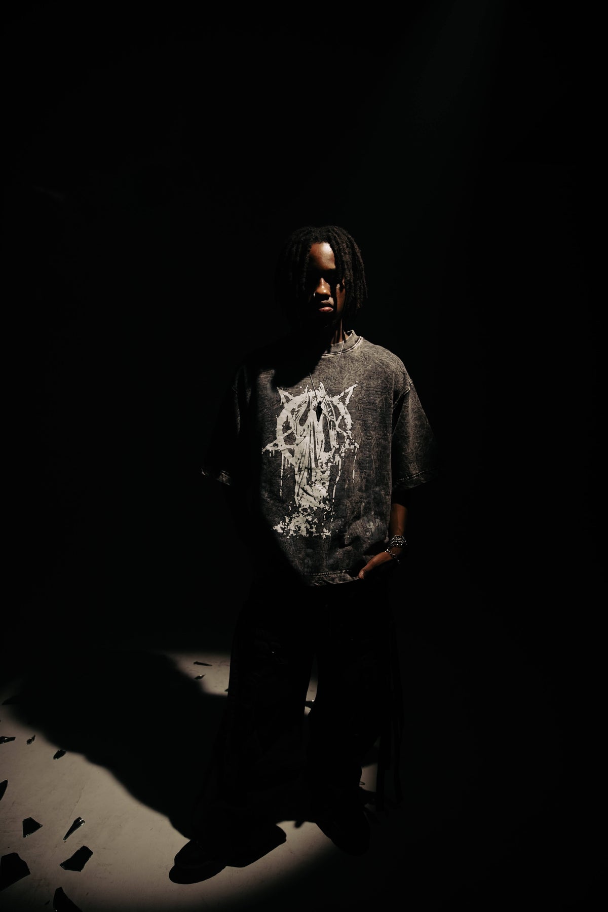 black abstract acid wash t-shirt with relaxed oversized streetwear silhouette