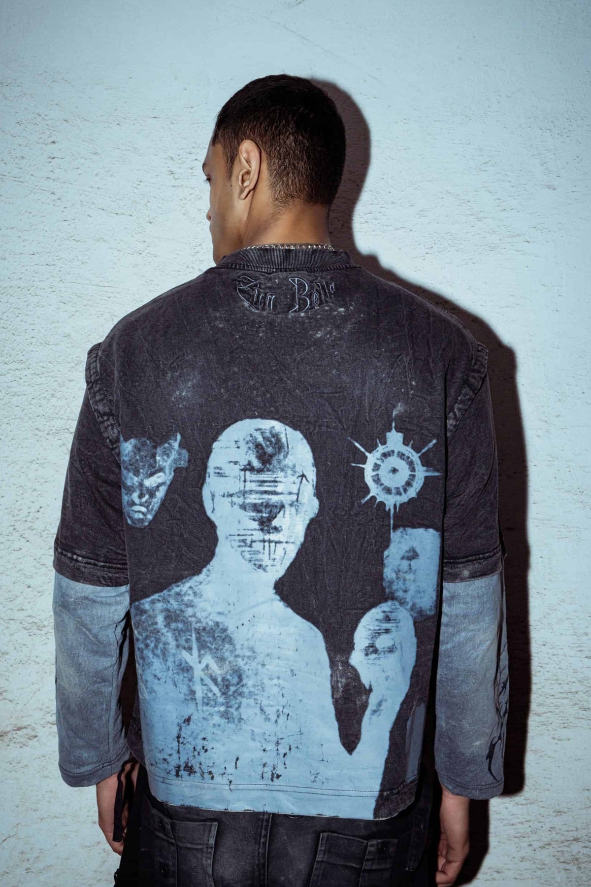 T-shirt made from premium cotton, acid washed black color, 240 gsm ,with a minimal graphic print and relaxed-fit silhouette