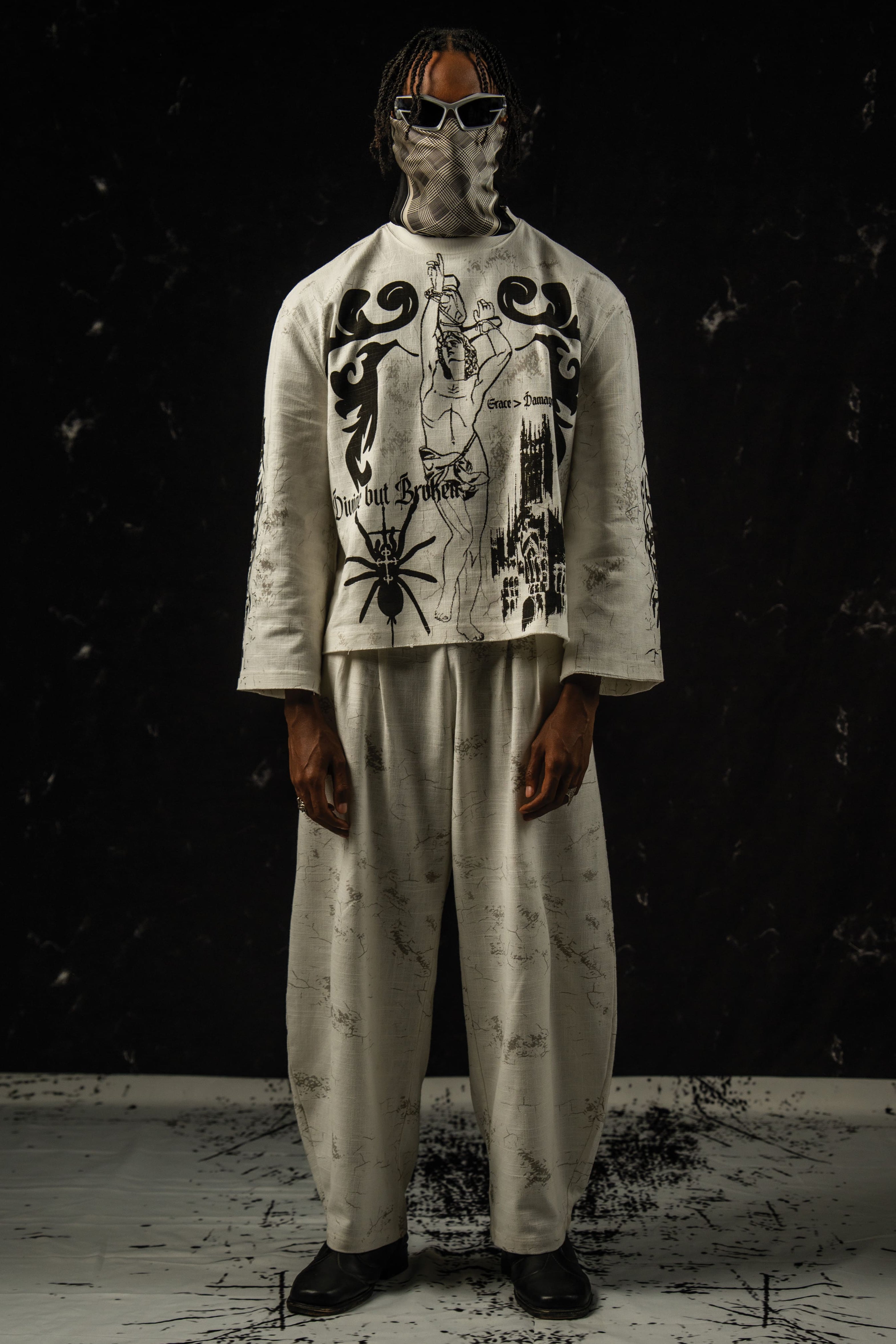 Relaxed fit unisex darkwear outfit styled with wide-leg pants and a graphic full sleeve t-shirt