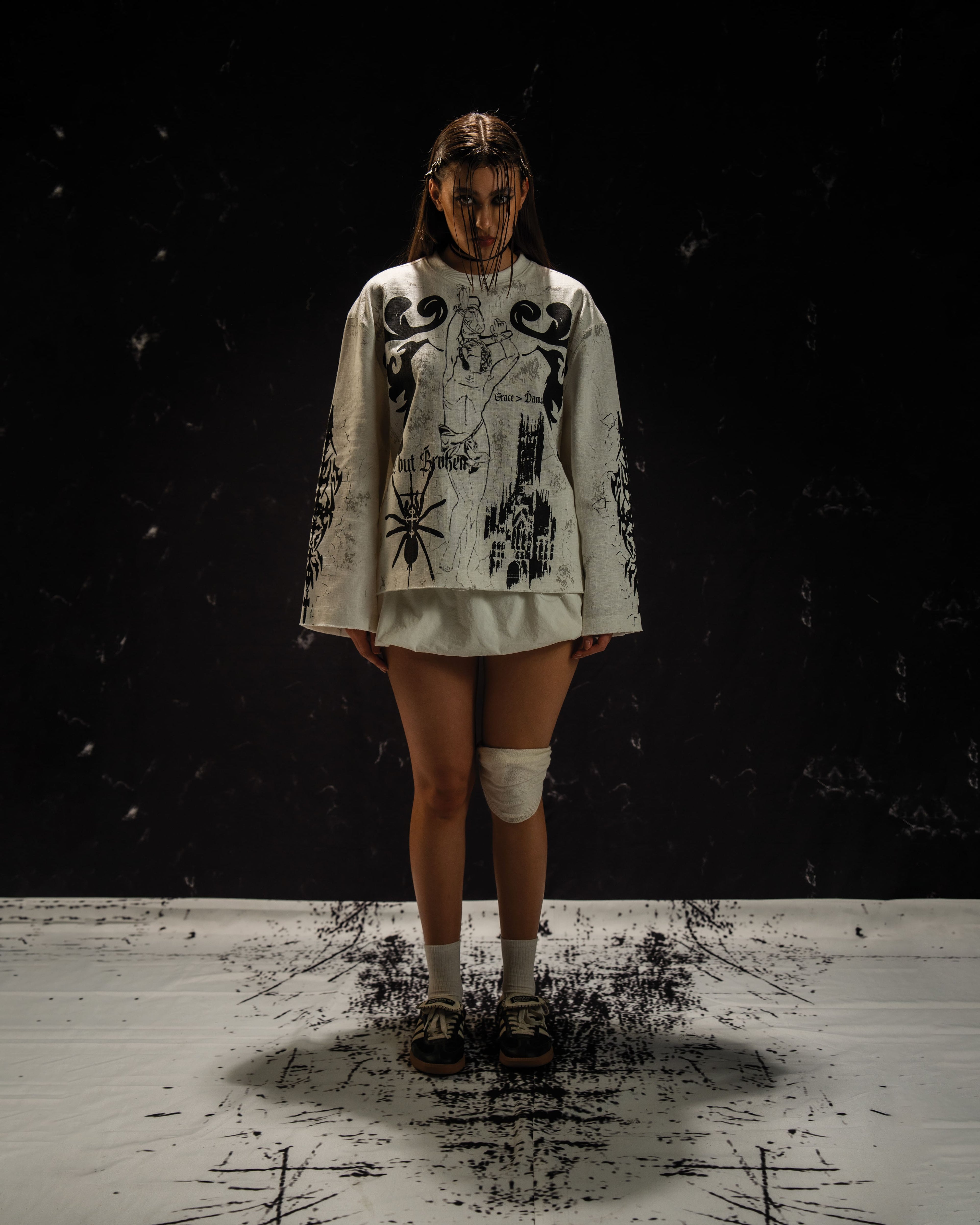 Women's darkwear outfit featuring a gothic oversized full sleeve tee and alternative styling