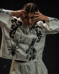 Women's gothic streetwear outfit featuring a relaxed oversized full sleeve t-shirt and alternative fashion styling