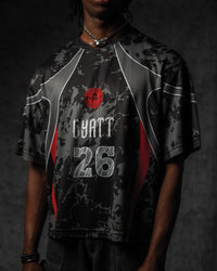 Studio side profile highlighting the seamless grey sublimation panel lines and relaxed sleeve drape on the jersey