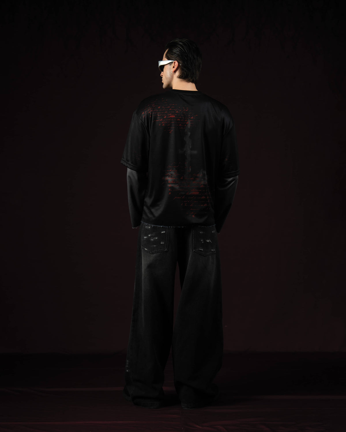 Zica Bella Bloodzic Jersey 01 black oversized streetwear jersey with red graphic back print worn by male model full rear view