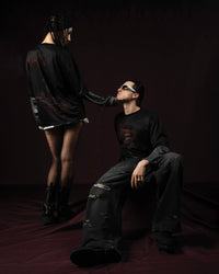 Zica Bella Bloodzic Jersey 01 black oversized streetwear jersey with red graphic styled on male and female models in editorial fashion scene