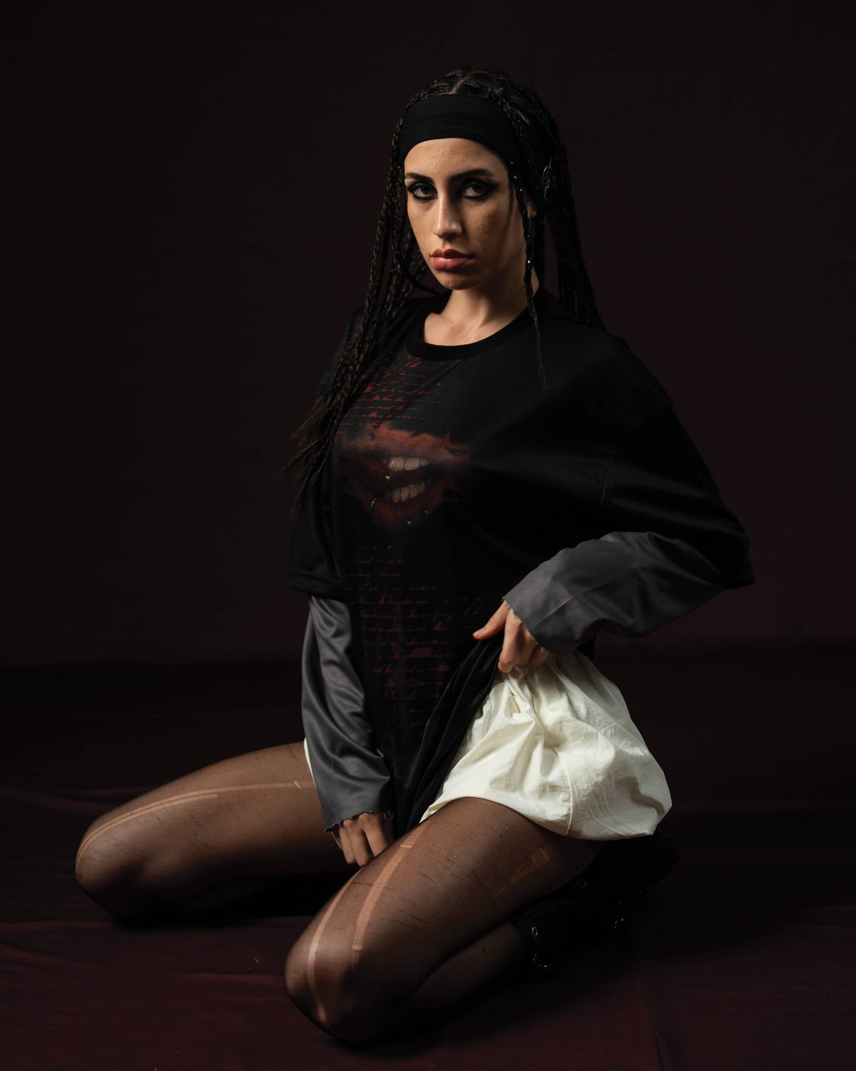 Zica Bella Bloodzic Jersey 01 black oversized streetwear jersey with red graphic styled on female model in editorial fashion pose