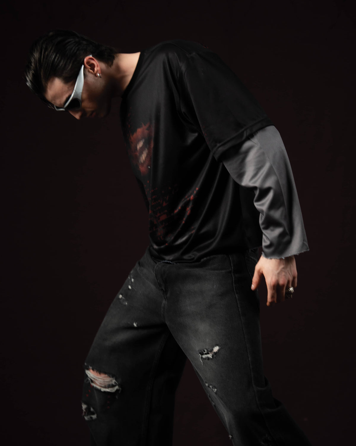 Zica Bella Bloodzic Jersey 01 black oversized streetwear jersey with red graphic worn by male model in dynamic lifestyle pose