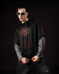Zica Bella Bloodzic Jersey 01 black oversized streetwear jersey with red graphic worn by male model in styled fashion pose
