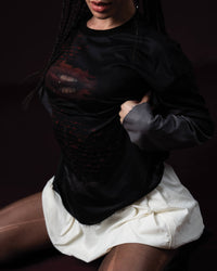 Zica Bella Bloodzic Jersey 01 black oversized streetwear jersey with red graphic worn by female model styled outfit detail