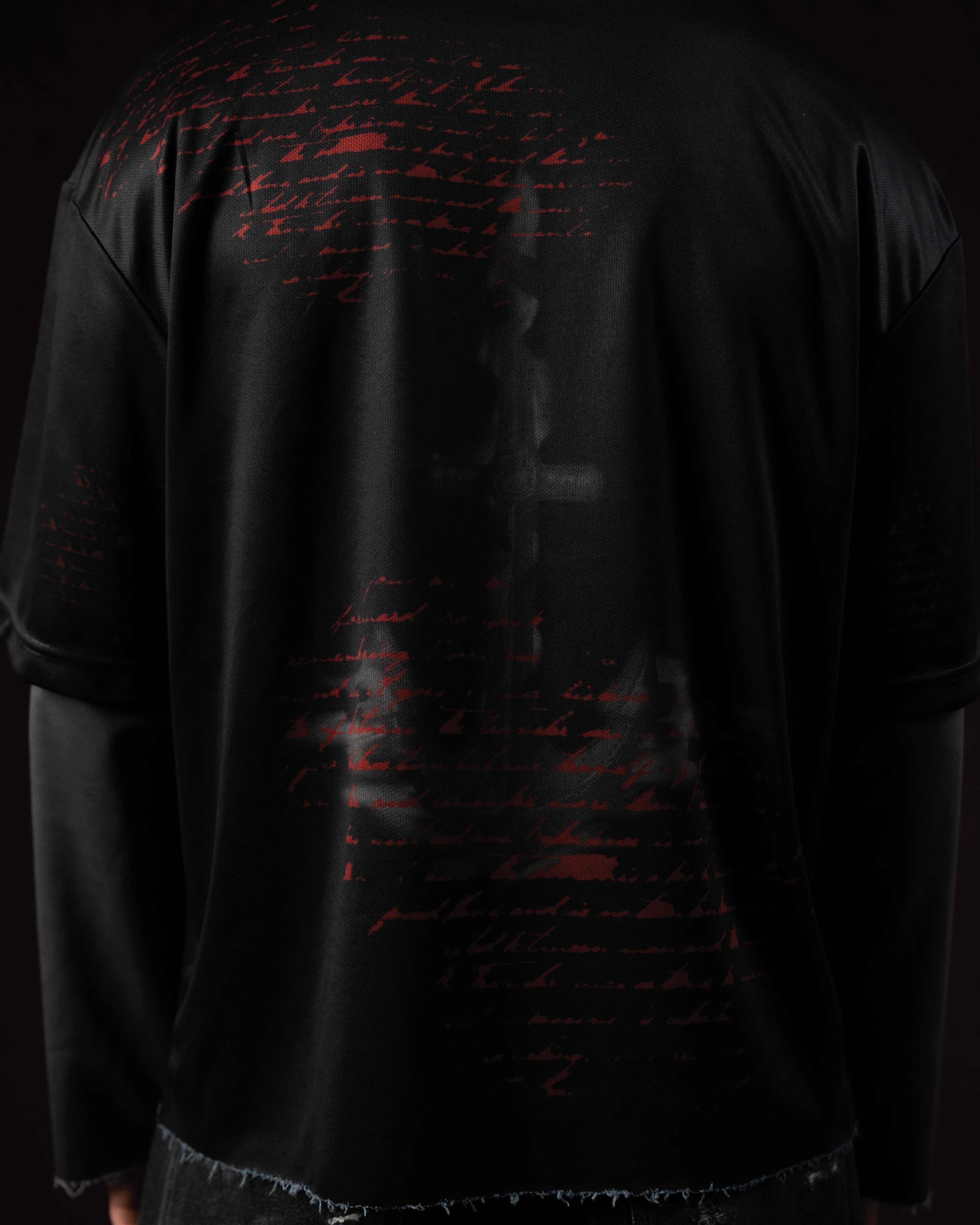 Zica Bella Bloodzic Jersey 01 black streetwear jersey with red distorted text graphic back design close up view