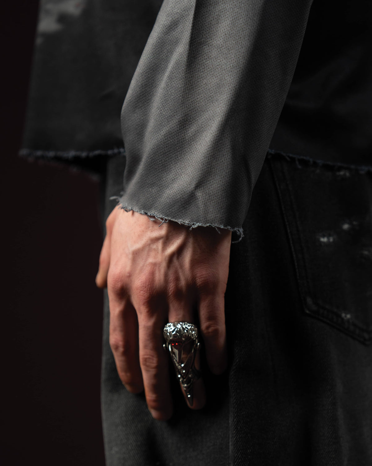 Zica Bella Bloodzic Jersey 01 black streetwear jersey raw sleeve hem detail with layered fabric and styling close up