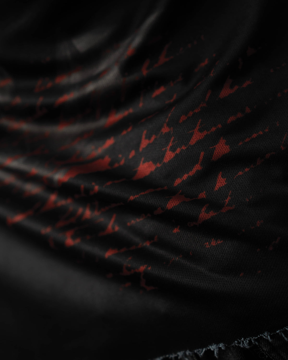 Zica Bella Bloodzic Jersey 01 black streetwear jersey with red abstract graphic fabric macro texture detail