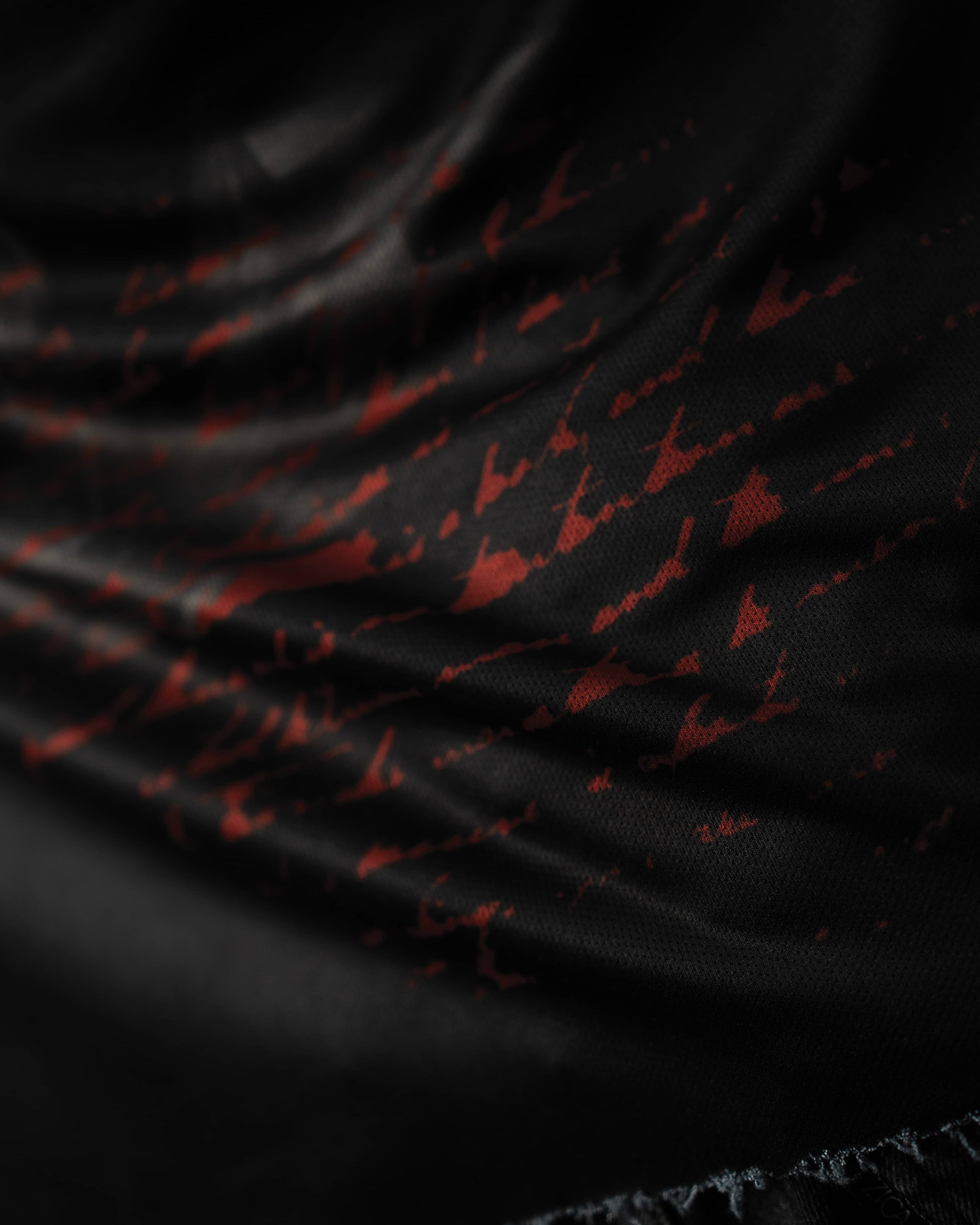 Zica Bella Bloodzic Jersey 01 black streetwear jersey with red abstract graphic fabric macro texture detail