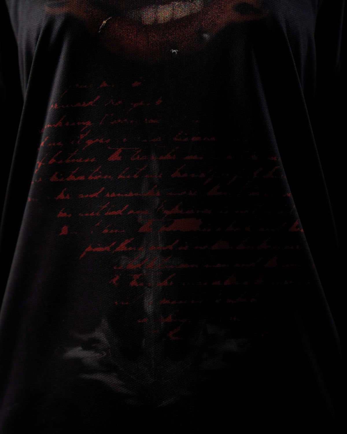 Zica Bella Bloodzic Jersey 01 black streetwear jersey with red handwritten text graphic fabric close up detail