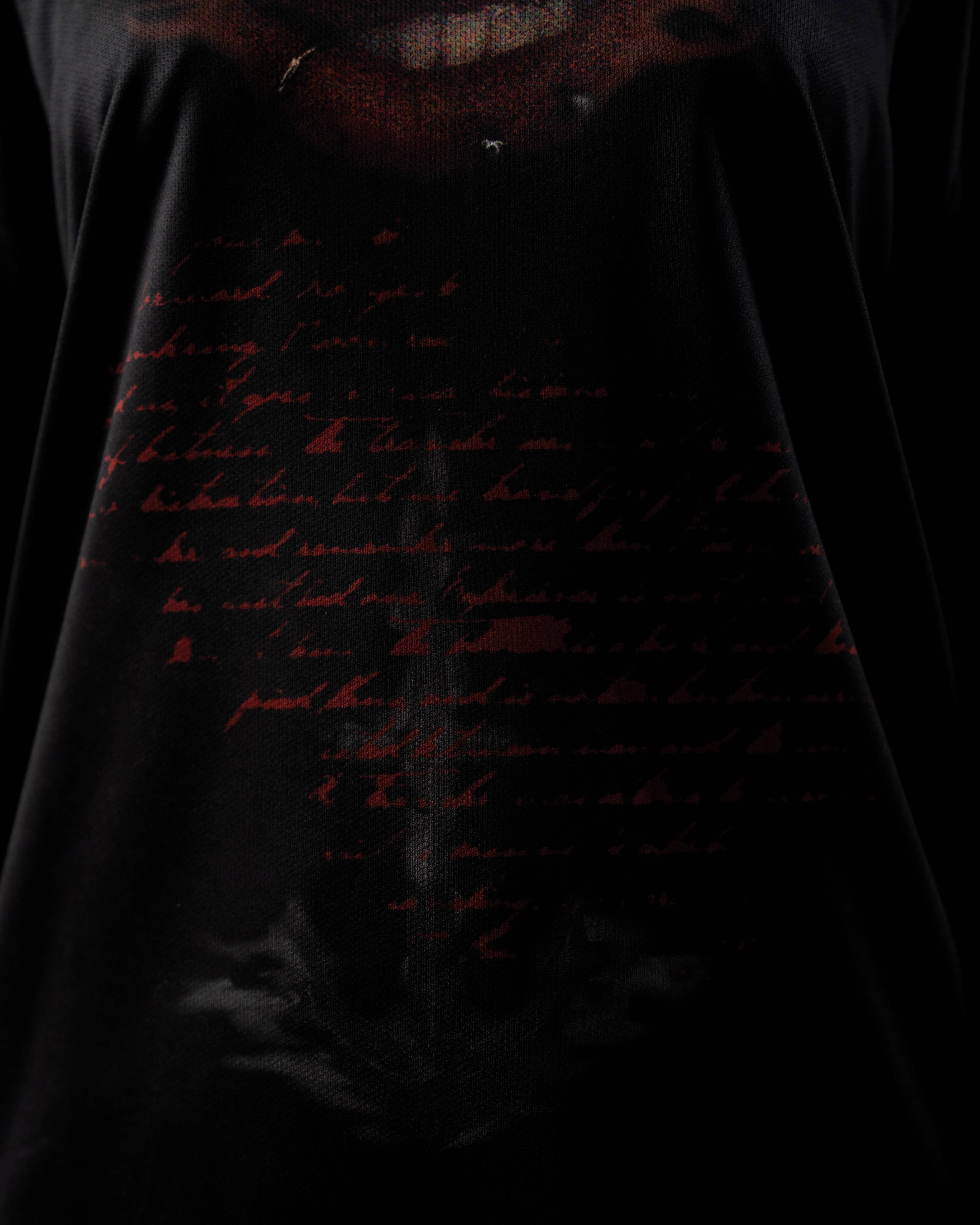 Zica Bella Bloodzic Jersey 01 black streetwear jersey with red handwritten text graphic fabric close up detail