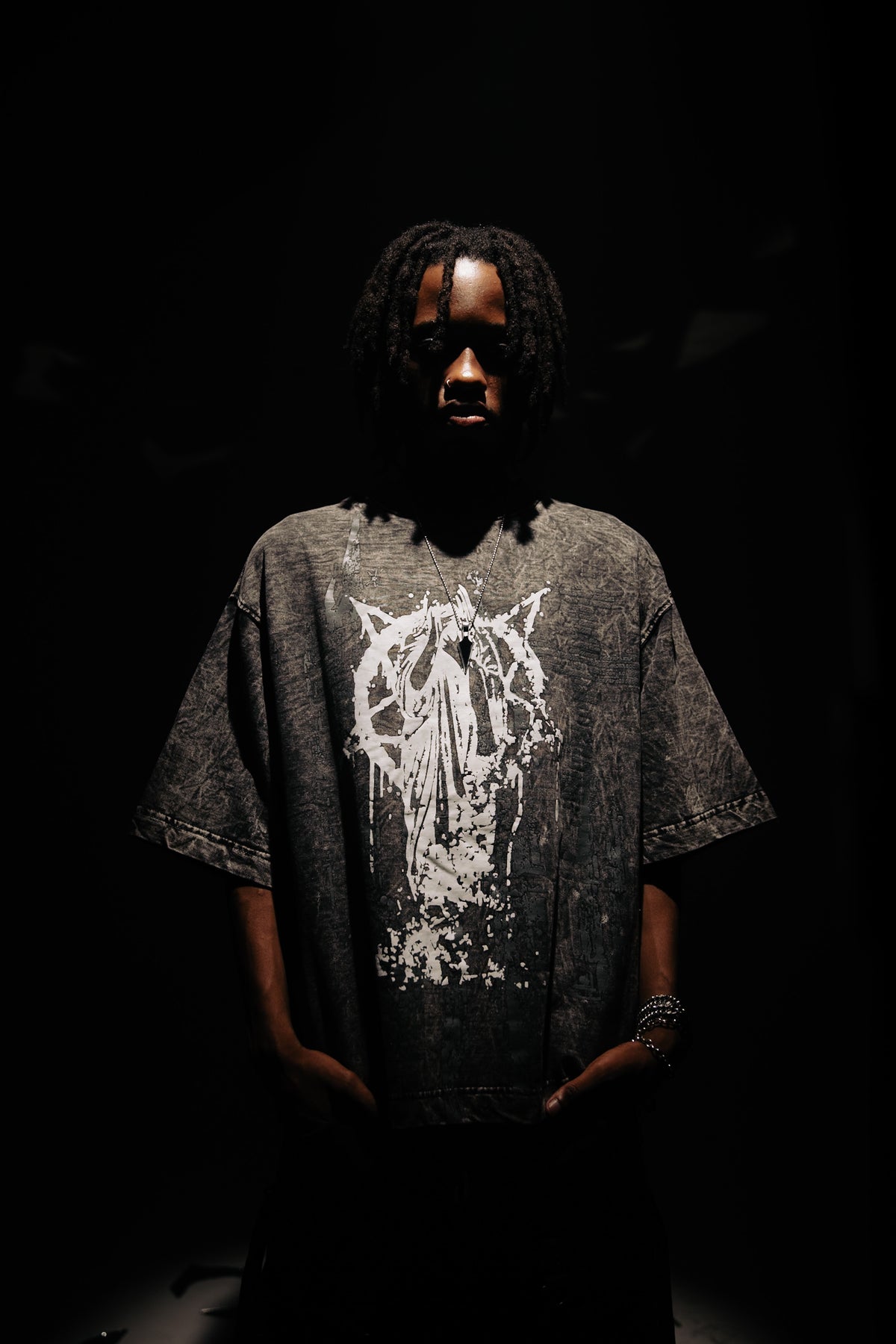 100% Cotton T-Shirt in Black, featuring a bold, artistic graphic design. Oversized fit for a modern streetwear aesthetic by zica bella