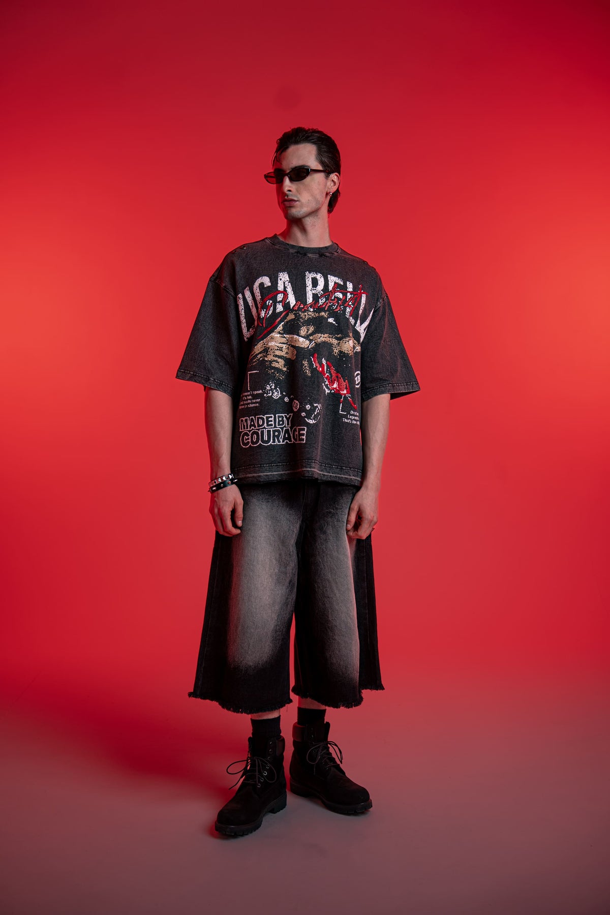 Front standing view of ZSTRIKE oversized black acid wash t-shirt with distressed print
