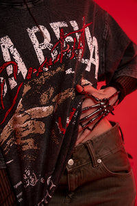 Closeup styling shot showcasing the unique acid wash texture and heavy graphic print