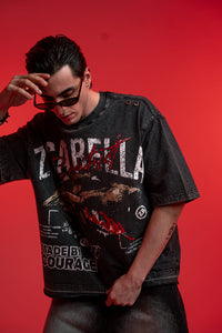 Male model styling ZSTRIKE black oversized streetwear tee with bold front graphic print