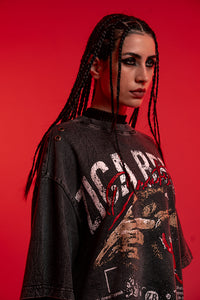 Female model wearing ZSTRIKE oversized streetwear tee with a distressed graphic design